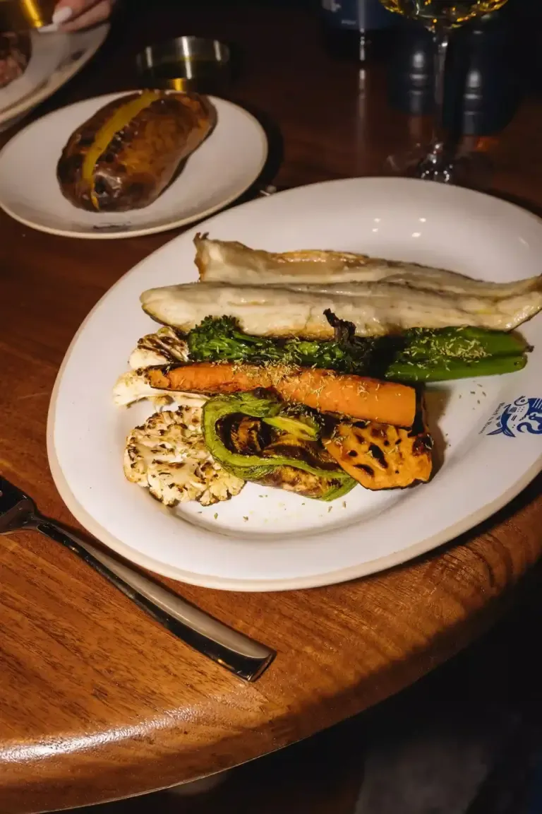 Sea bass with vegetables served at Beef&Bass